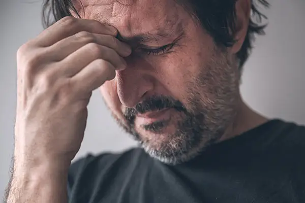 Anxious man has a headache