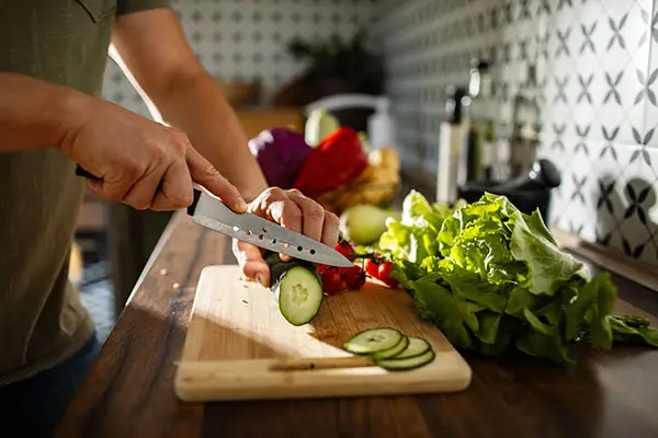 Man chopping vegetables for healthy meal